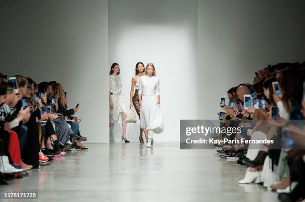 Models walk the runway during the Kristina Fidelskaya Womenswear Spring/Summer 2020 show as part of Paris Fashion Week on September 30, 2019 in...