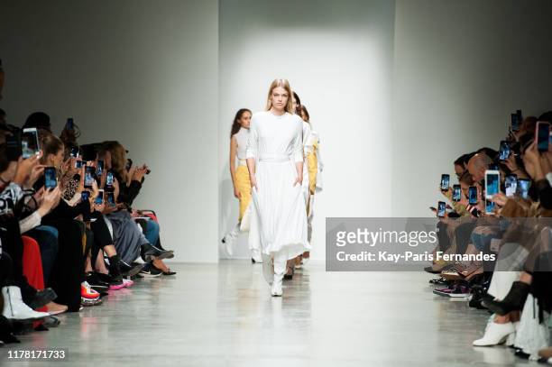Models walk the runway during the Kristina Fidelskaya Womenswear Spring/Summer 2020 show as part of Paris Fashion Week on September 30, 2019 in...