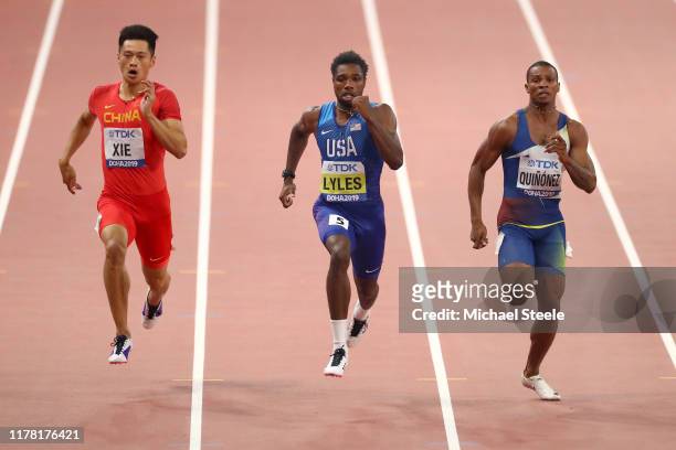 Zhenye Xie of China, Noah Lyles of the United States and Alex Quiñónez of Ecuador compete in the Men's 200 metres semi finals during day four of 17th...