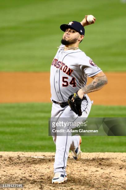 Roberto Osuna of the Houston Astros pitches against the Washington Nationals during Game 3 of the 2019 World Series at Nationals Park on Friday,...