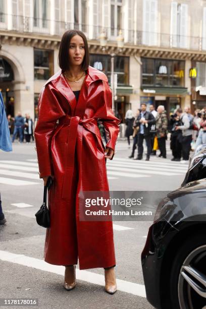 Alexandra Guerain wearing red patent trench coat outside Giambattista Valli during Paris Fashion Week Womenswear Spring Summer 2020 on September 30,...