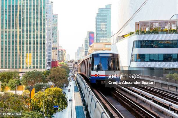 bangkok skyline with modern skyscrapers and bts skytrain, thailand - bts bangkok stock pictures, royalty-free photos & images