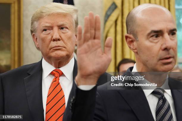 President Donald Trump looks on as Labor Secretary Eugene Scalia is ceremonially sworn in at the White House September 30, 2019 in Washington, DC....