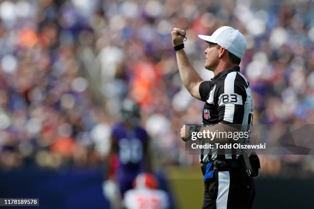 Referee Shawn Hochuli signals fourth down in the first half of the game between the Baltimore Ravens and the Cleveland Browns at M&T Bank Stadium on...