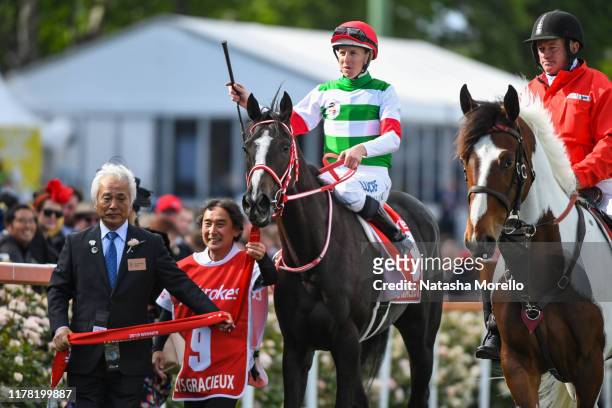 Damian Lane returns to the mounting yard aboard Lys Gracieux after winning the Ladbrokes Cox Plate at Moonee Valley Racecourse on October 26, 2019 in...