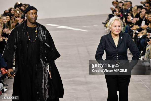 Singer Oxmo Puccino and designer Agnes Trouble walk the runway during the Agnes B. Ready to Wear Spring/Summer 2020 fashion show as part of Paris...