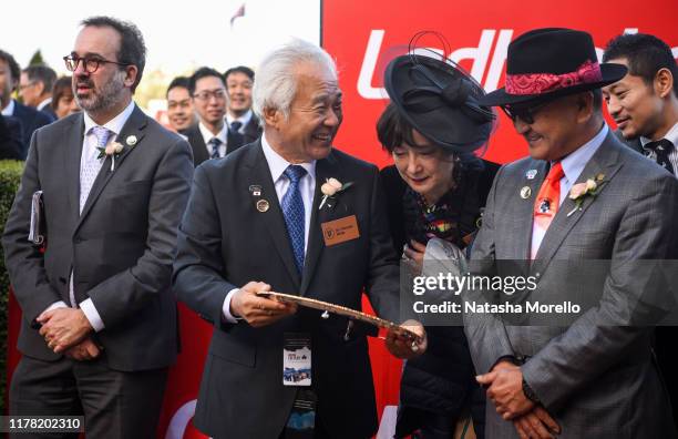 Connections of Lys Gracieux , Dr Hiroaki Akita with the trophy after winning the Ladbrokes Cox Plate at Moonee Valley Racecourse on October 26, 2019...