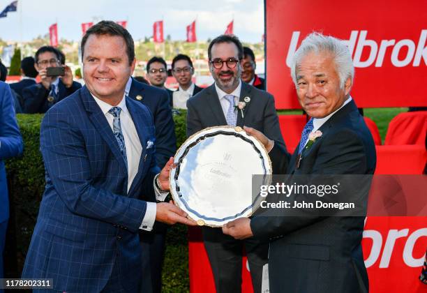 Connections of Lys Gracieux , Dr Hiroaki Akita with the trophy after winning the Ladbrokes Cox Plate ,at Moonee Valley Racecourse on October 26, 2019...