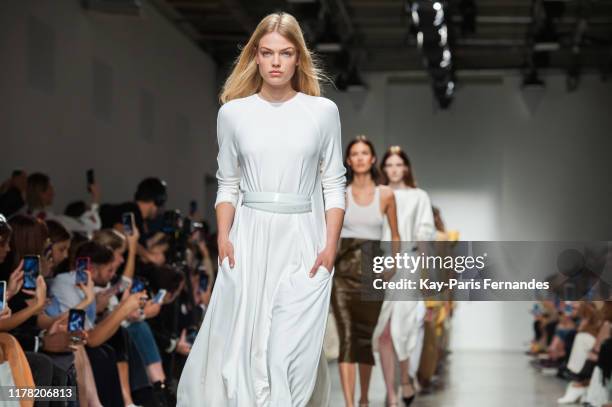Model walk the runway during the Kristina Fidelskaya Womenswear Spring/Summer 2020 show as part of Paris Fashion Week on September 30, 2019 in Paris,...