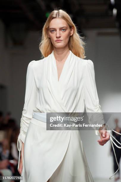 Model walks the runway during the Kristina Fidelskaya Womenswear Spring/Summer 2020 show as part of Paris Fashion Week on September 30, 2019 in...