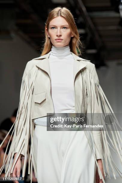 Model walks the runway during the Kristina Fidelskaya Womenswear Spring/Summer 2020 show as part of Paris Fashion Week on September 30, 2019 in...