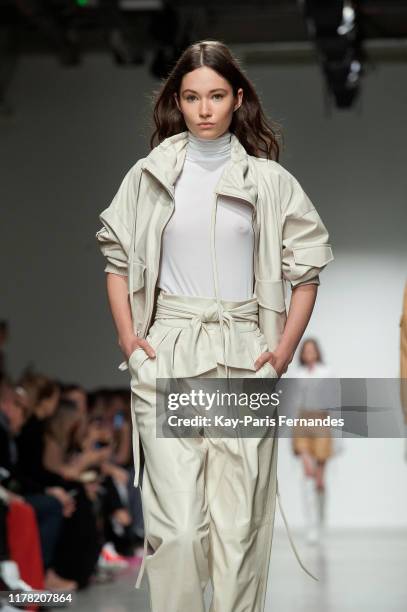 Model walks the runway during the Kristina Fidelskaya Womenswear Spring/Summer 2020 show as part of Paris Fashion Week on September 30, 2019 in...