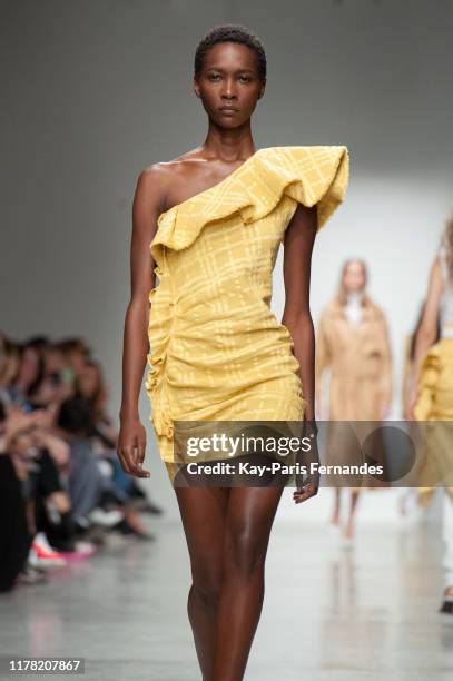 Model walks the runway during the Kristina Fidelskaya Womenswear Spring/Summer 2020 show as part of Paris Fashion Week on September 30, 2019 in...