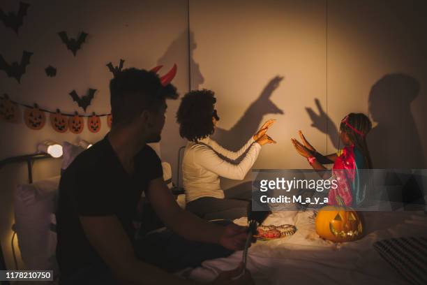 shadow play - family game night stock pictures, royalty-free photos & images