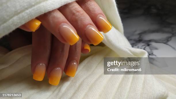 close-up of woman fingers with nail art manicure - ombré imagens e fotografias de stock