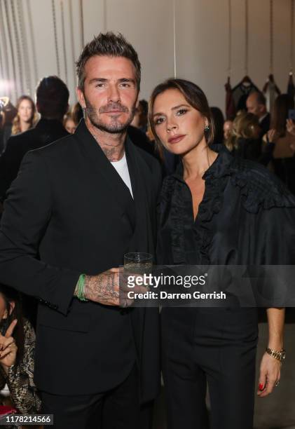 David and Victoria Beckham attend Victoria Beckham and Sotheby's celebration of Andy Warhol with Don Julio 1942 at her Dover Street store, on...