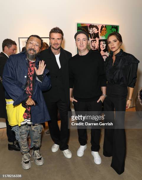 Takashi Murakami, David Beckham, Brian Donnelly aka Kaws and Victoria Beckham attend Victoria Beckham and Sotheby's celebration of Andy Warhol with...