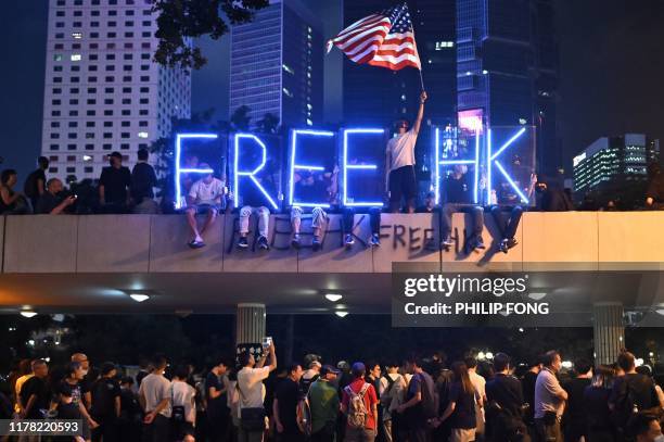 Light installation that reads "Free HK" is seen as people take part in a rally of healthcare professionals, part of larger pro-democracy...