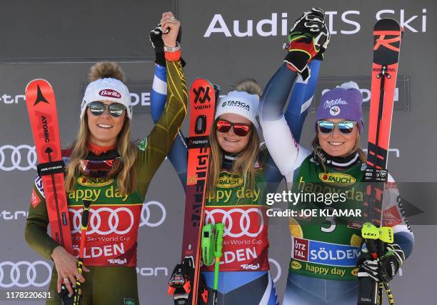 Second placed US's Mikaela Schiffrin, winner New Zealand's Alice Robinson and third placed France's Tessa Worley pose on the podium of the Women's...