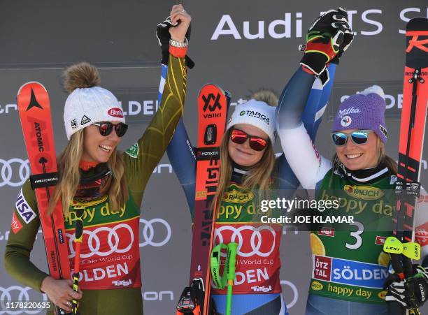 Second placed US's Mikaela Schiffrin, winner New Zealand's Alice Robinson and third placed France's Tessa Worley pose on the podium of the Women's...