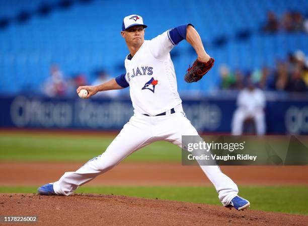 Clay Buchholz of the Toronto Blue Jays delivers a pitch in the first inning during a MLB game against the Boston Red Sox at Rogers Centre on...