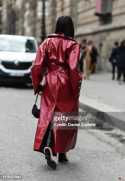 Alexandra Guerain is seen wearing a red Giambattista Valli coat outside the Giambattista Valli show during Paris Fashion Week SS20 on September 30,...
