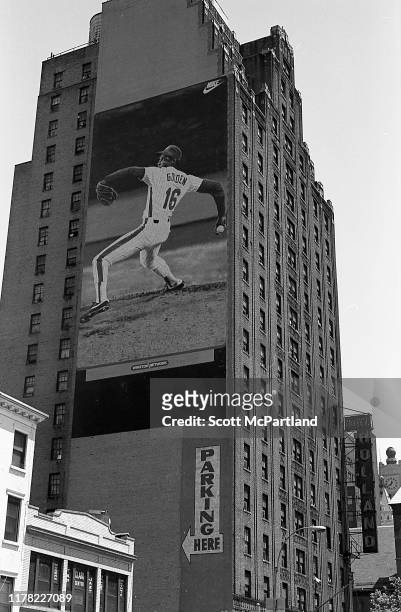 View of the Hotel Holland on 42nd Street and 9th Avenue, New York, New York, May 16, 1987. An eight-story tall Nike billboard, featuring baseball...