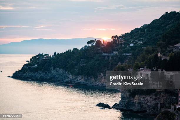 sunset over bay of sori with cliff house - sori liguria stock pictures, royalty-free photos & images