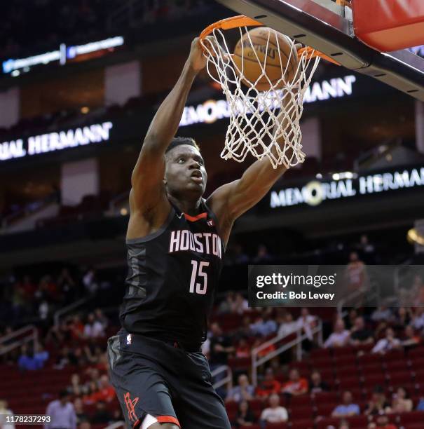 Clint Capela of the Houston Rockets dunks against the Shanghai Sharks during the second quarter at Toyota Center on September 30, 2019 in Houston,...