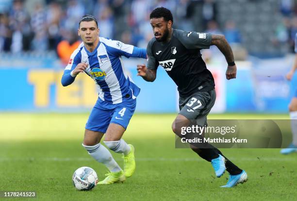 Karim Rekik of Berlin challenges for the ball with Juergen Locadia of Hoffenheim during the Bundesliga match between Hertha BSC and TSG 1899...