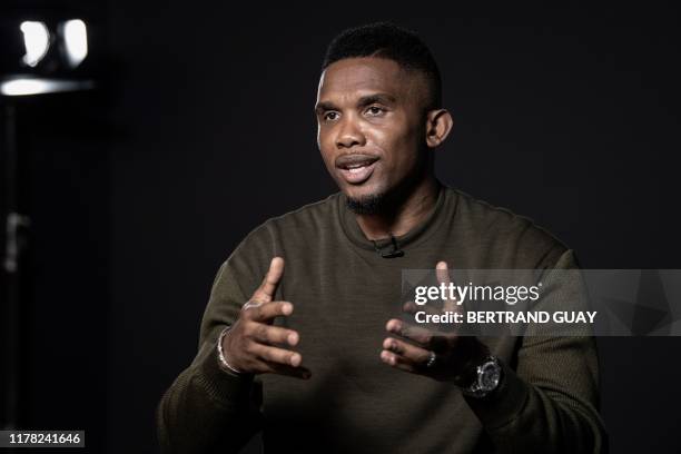 Former Cameroonian forward Samuel Eto'o poses during a photo session on October 24, 2019 in Paris.