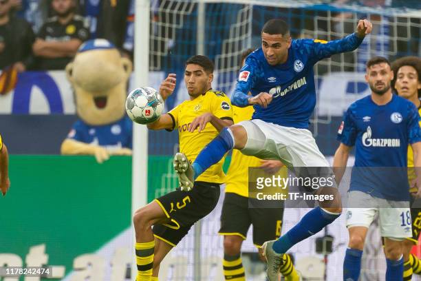 Achraf Hakimi of Borussia Dortmund and Omar Mascarell of FC Schalke 04 battle for the ball during the Bundesliga match between FC Schalke 04 and...