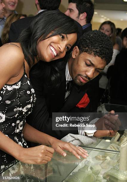 Faune Chambers and Fonzworth Bentley look at Erica Courtney jewelry