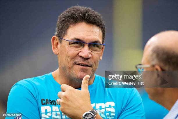 Owner David Tepper and Head Coach Ron Rivera of the Carolina Panthers talk on the field before a game against the Houston Texans at NRG Stadium on...