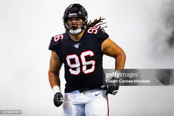 Tyeler Davison of the Atlanta Falcons runs onto the field prior to the start of the game against the Tennessee Titans at Mercedes-Benz Stadium on...
