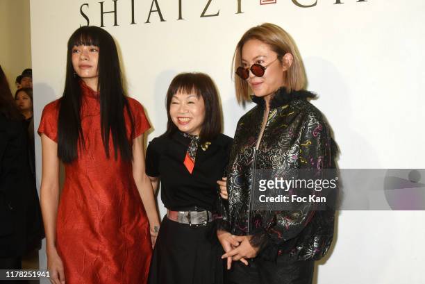 Yuanyuan Kuo, Shiatzy Chen designer Wang Chen Tsai-Hsia and a guest attend the Shiatzy Chen Womenswear Spring/Summer 2020 show as part of Paris...