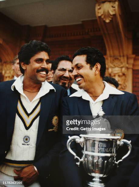 India players Kapil Dev and Man of the Match Mohinder Amarnath pictured with the trophy after the 1983 Prudential World Cup Final victory against...