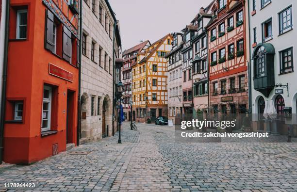 idyllic viewof row houses on street, weissgerbergasse in nuremberg city, germany - european street stock pictures, royalty-free photos & images