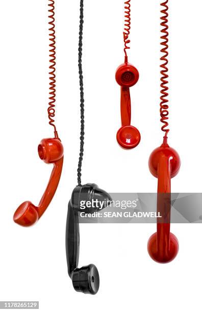 hanging telephone receivers - antique phone photos et images de collection