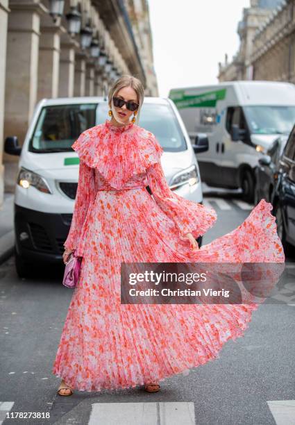 Shea Marie seen wearing salmon colored dress outside Giambattista Valli during Paris Fashion Week Womenswear Spring Summer 2020 on September 30, 2019...