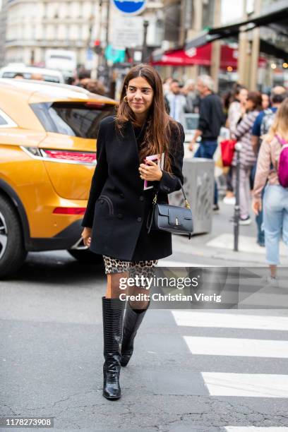 Georgia Tal seen wearing cycle pants with animal print, black blazer, bag, boots outside Giambattista Valli during Paris Fashion Week Womenswear...