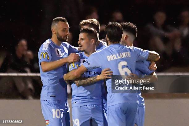 Jamie Maclaren of Melbourne City celebrates with team mates after scoring his team's second goal during the FFA Cup 2019 Semi Final between the...