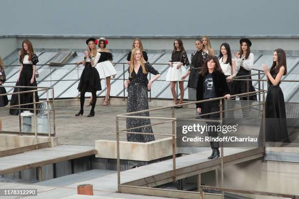 Chanel Designer Virginie Viard and models whose Kaia Gerber acknowledge the applause of the audience at the end of the Chanel Womenswear...