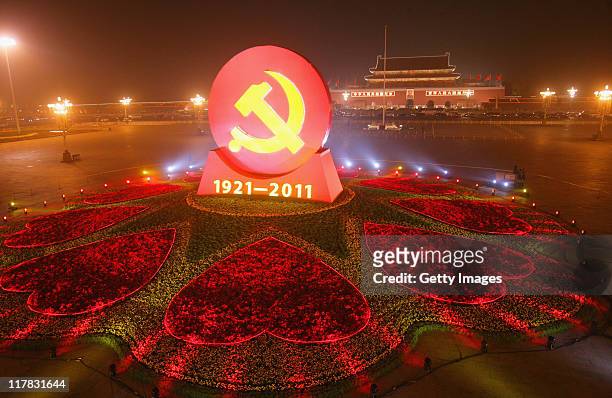 Huge emblem of the Chinese Communist Party is seen at Tian'anmen Square on June 30, 2011 in Beijing, China. People from all over China celebrate...