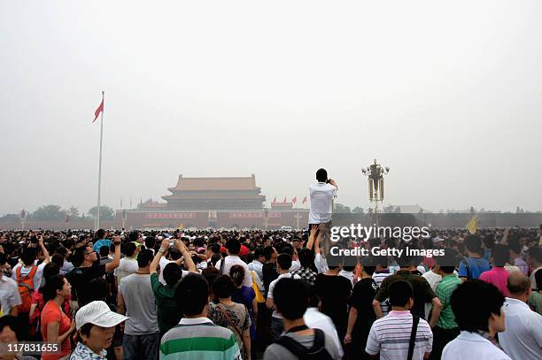 Tens of thousands of people gather at Tian'anmen Square for the flag-raising ceremony on July 1, 2011 in Beijing, China. People from all over China...