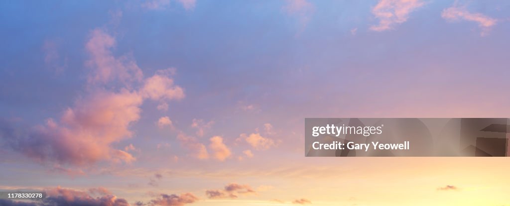 Fluffy clouds at sunset