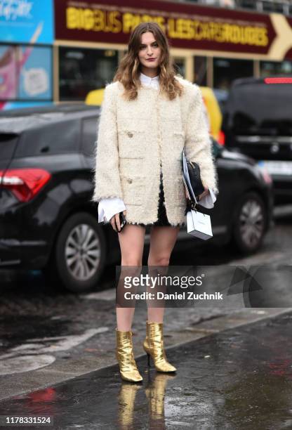 Guests are seen wearing Chanel outside the Chanel show during Paris Fashion Week SS20 on October 1, 2019 in Paris, France.
