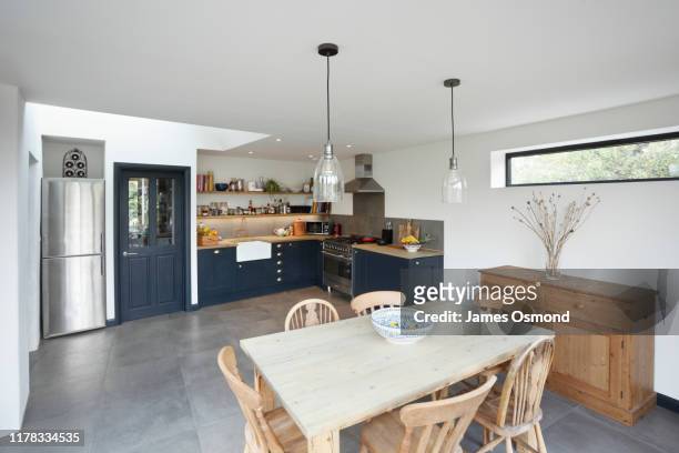new kitchen and diner extension interior. built onto the side of a listed historic building. - table kitchen modern photos et images de collection