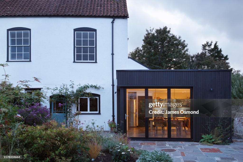 Modern extension built onto the side of a listed period property.