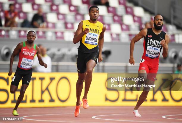 Alphas Leken Kishoyian of Kenya, Akeem Bloomfield of Jamaica and Machel Cedenio of Trinidad and Tobago compete in the Men's 400 Metres heats during...